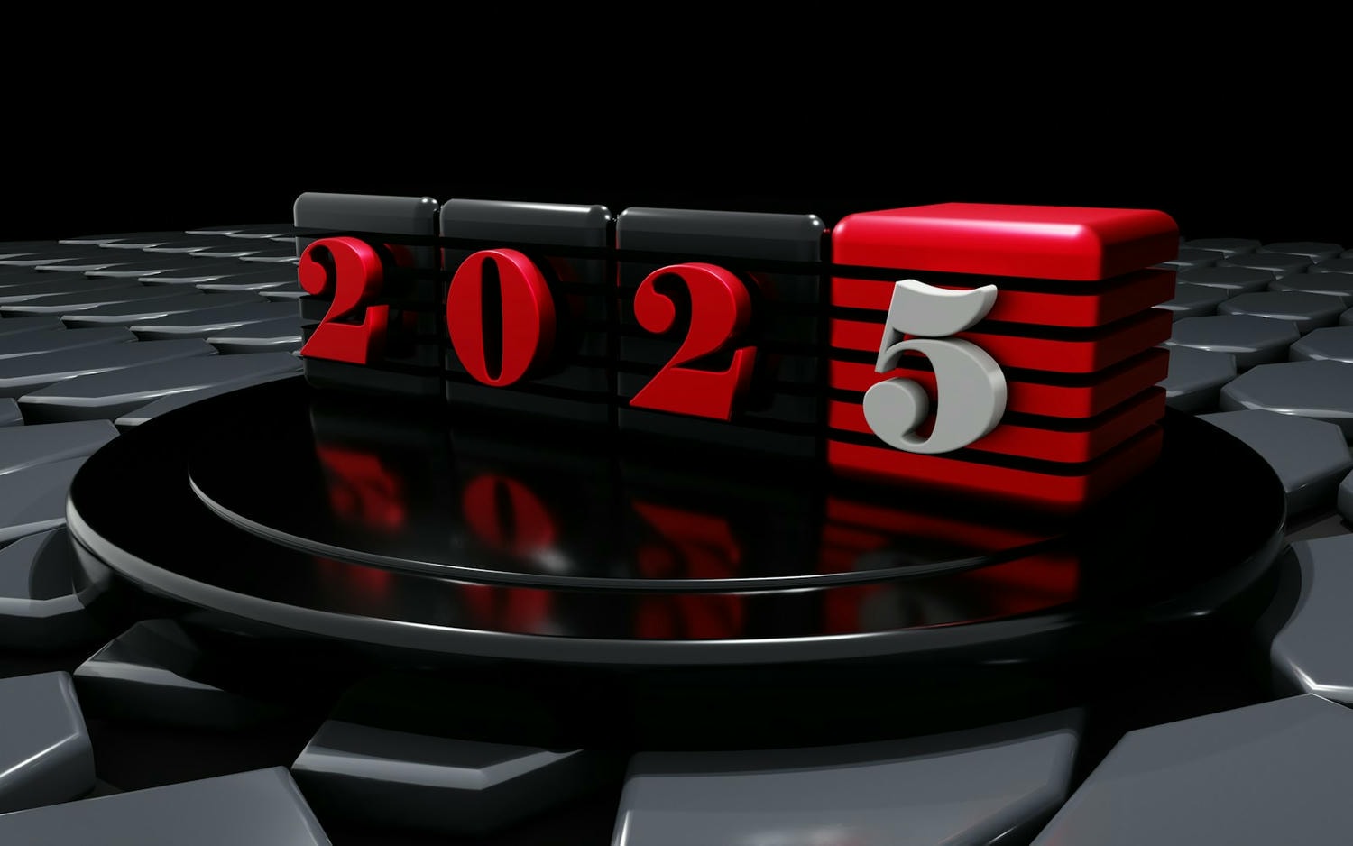 A red and black calendar sitting on top of a computer keyboard